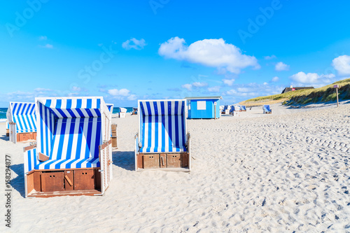 Wicker chairs on sandy beach in Kampen village on Sylt island  North Sea  Germany