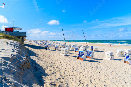 Wicker chairs on Kampen beach on sunny summer day, Sylt island, North Sea, Germany