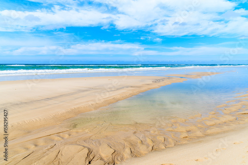 Shallow crystal clear sea water at Kampen beach at low tide  Sylt island  North Sea  Germany