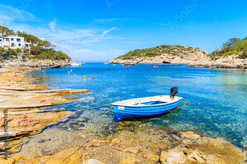 Small fishing boat on shore Cala Portinatx bay  Ibiza island  Spain