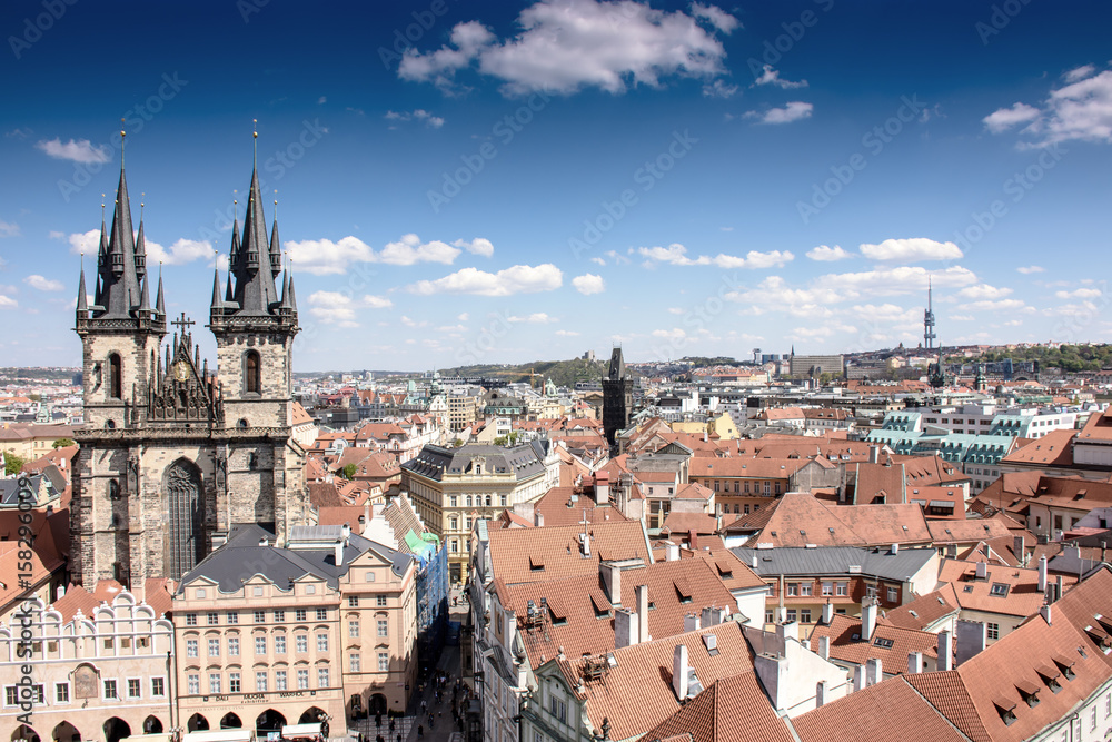 Old town of Prague with beautiful houses with tiles and an old castle