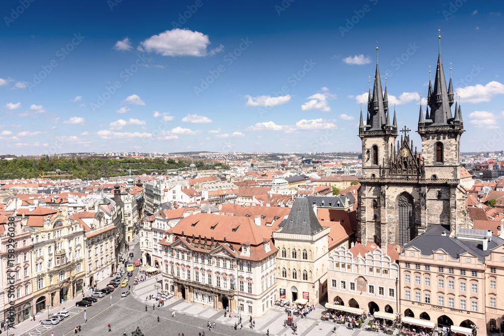 Old town of Prague with beautiful houses with tiles and an old castle