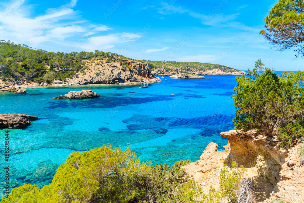 Fototapeta premium Stunning view of Cala Xarraca bay with azure sea water on northern coast of Ibiza island, Spain