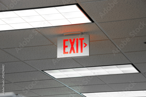 red exit sign and light on the ceiling