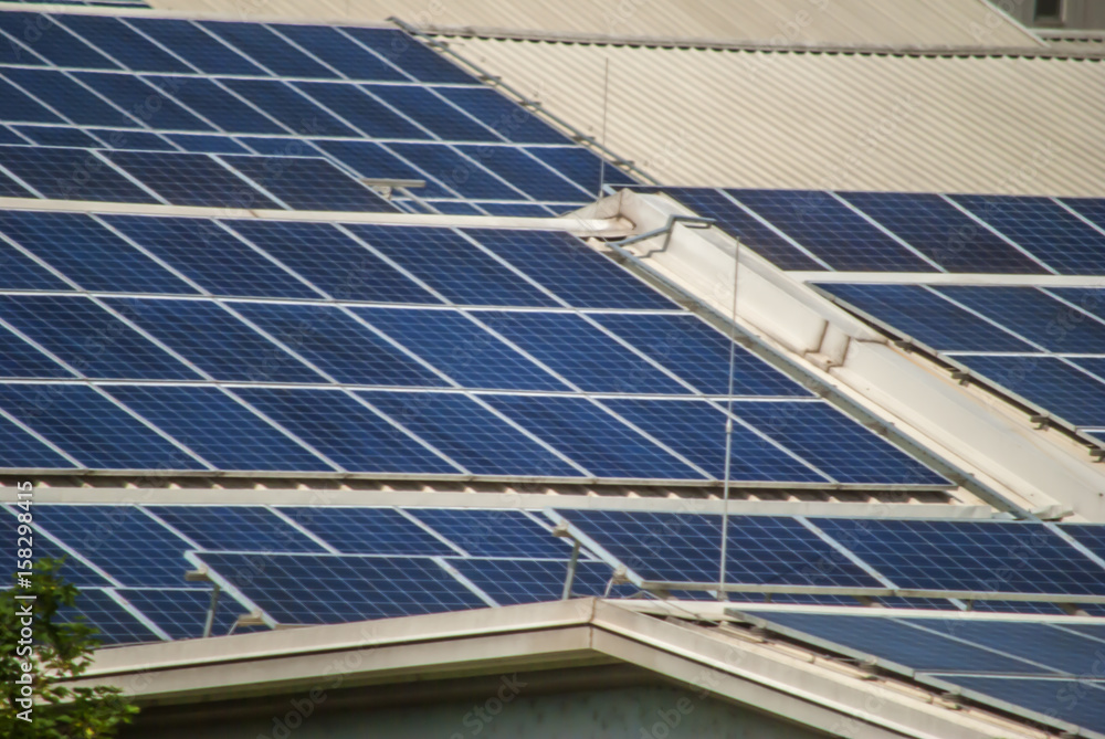 Obraz premium solar panels on top of industrial roof object