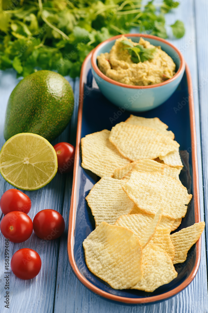 Guacamole - mexican avocado dip with tomato and lime. 
