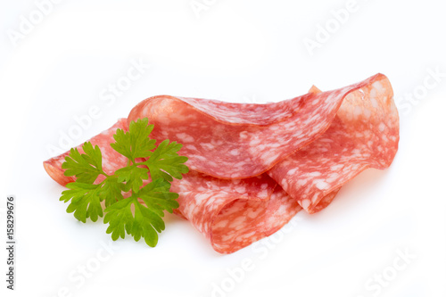 Salami smoked sausage slices isolated on white background cutout.