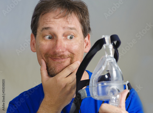 Man with a CPAP mask photo