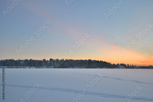 Winter landscape at sunset.