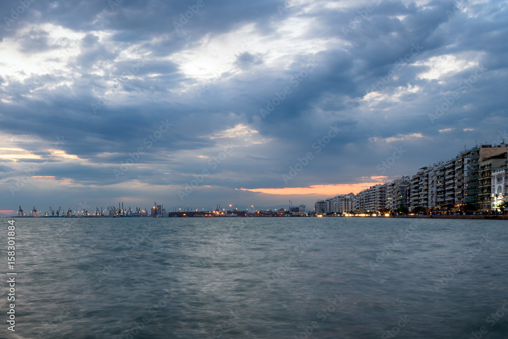 Embankment of Thessaloniki at dusk with stormy clouds