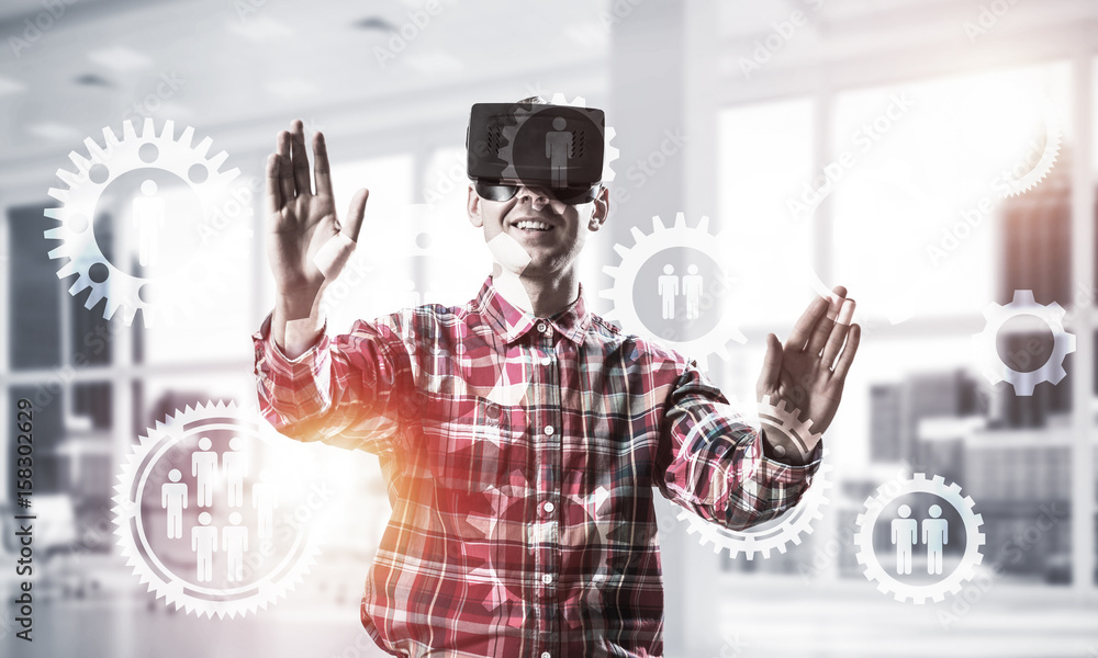 Guy wearing checked shirt and virtual mask demonstrating some em Guy wearing checked shirt and virtual mask demonstrating some em