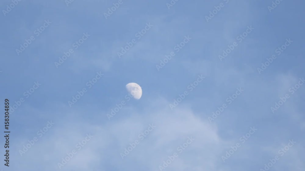 White moon with cloud moving in sunny day at real time White moon with cloud moving in sunny day at real time