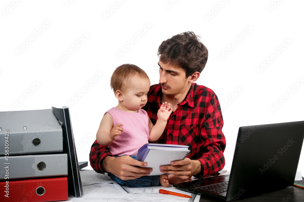 young father sits at office table with baby, documents. laptop. isolated on white young father sits at office table with baby, documents. laptop. isolated on white