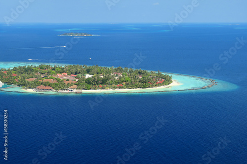 Maldives islands and resorts top view from airplane photo
