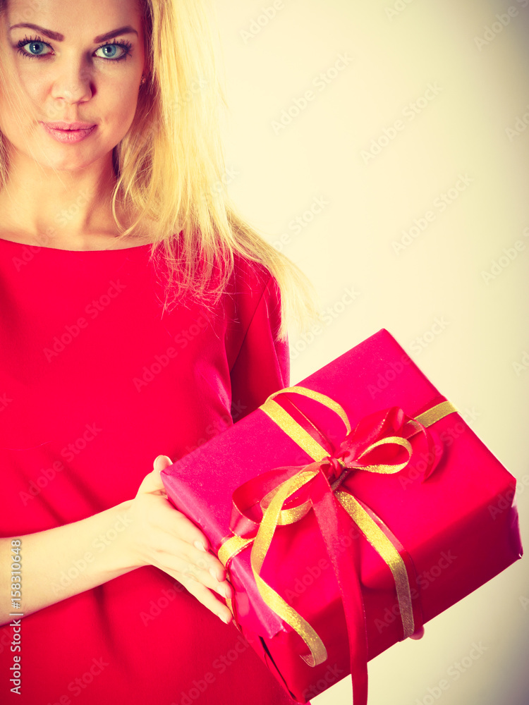 Beautiful woman with big red gift. Beautiful woman with big red gift.