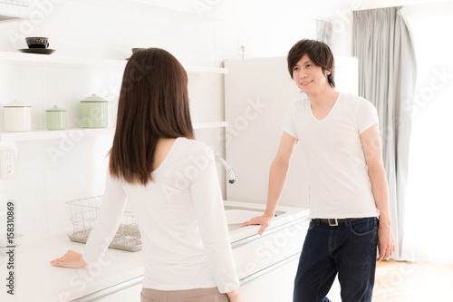 young asian couple relaxing in kitchen