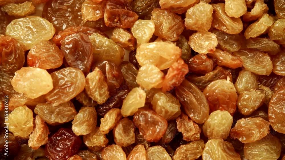 Raisin dried grape as background texture. Healthy food organic nutrition. Dolly slider shot 4K ProRes HQ codec Raisin dried grape as background texture. Healthy food organic nutrition. Dolly slider shot 4K ProRes HQ codec
