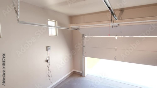 Interior Garage Door Closing Move From Motor. starting at garage door opener motor inside the garage and moves down as garage door closes
