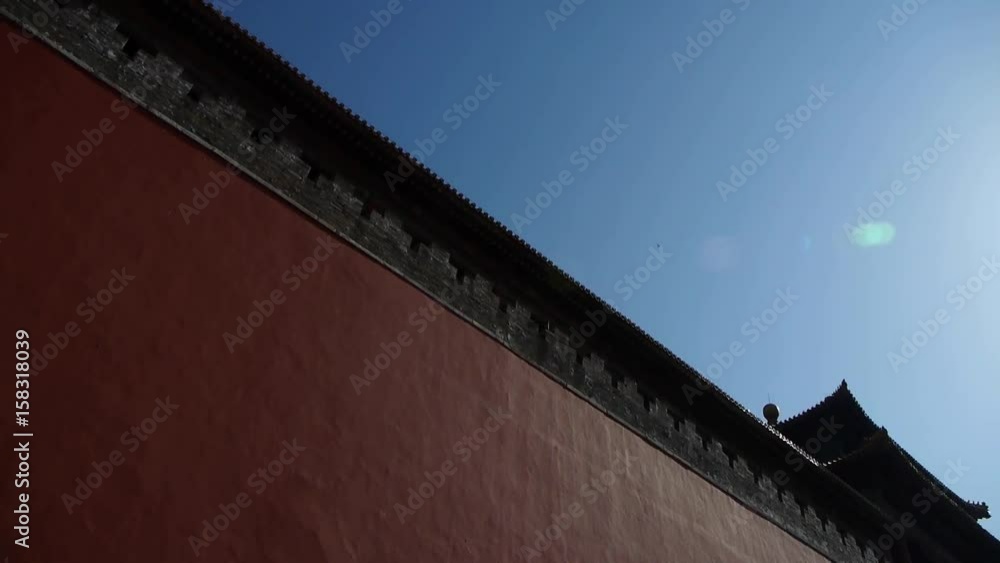 red beijing forbidden city wall with sun,China's royal Meridian Gate. red beijing forbidden city wall with sun,China's royal Meridian Gate.