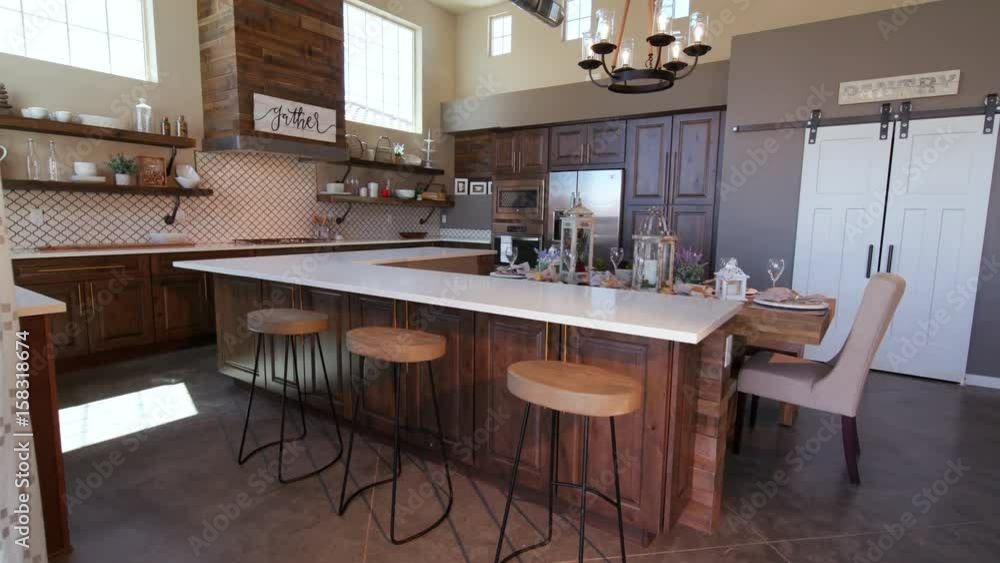 Rising on Modern Kitchen Island with Stools. a loft style rustic industrial kitchen rises to reveal high ceilings
Rising on Modern Kitchen Island with Stools. a loft style rustic industrial kitchen rises to reveal high ceilings