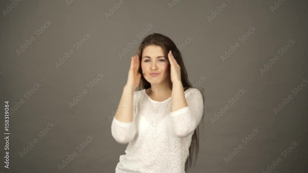 Woman having fun dancing, joyful young female showing positive expression, studio shot grey wall background 4 Woman having fun dancing, joyful young female showing positive expression, studio shot grey wall background 4