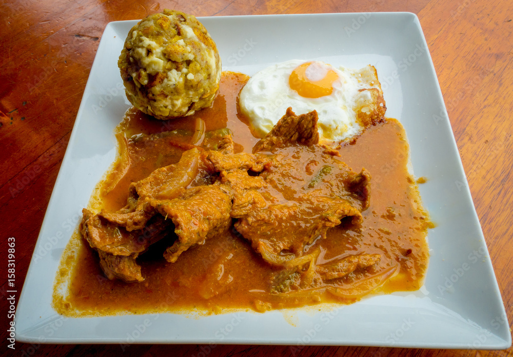 Bolon de verde with fried eggs and meat stew ecuadorian food galapagos Bolon de verde with fried eggs and meat stew ecuadorian food galapagos