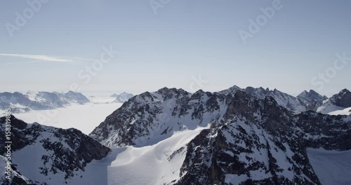areal shot of mystic mountains and sea in Greenland