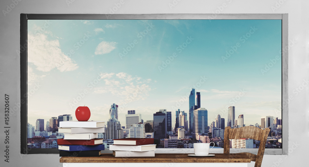 wooden table with books, with city view background