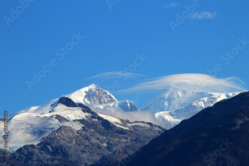 Typical foehn clouds, altocumulus lenticularis lent, in the mountains, Patagonia, Chile photo