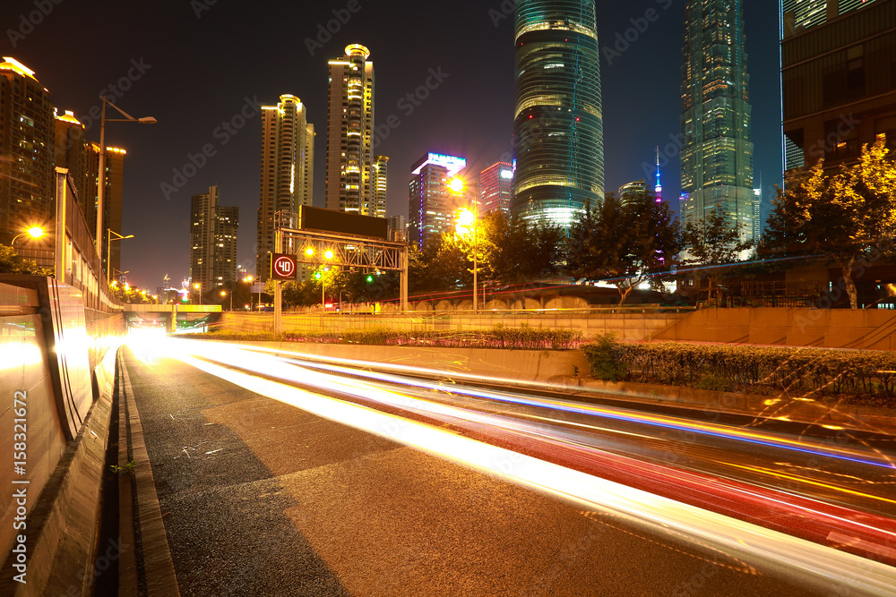 Empty road surface with city landmark buildings of night