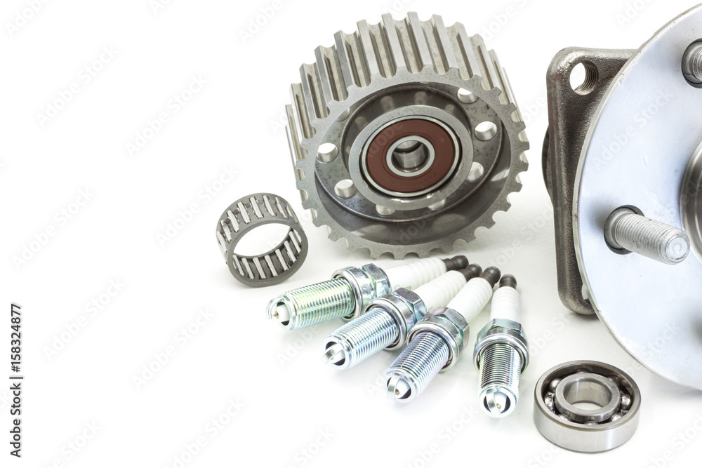 Bearing and ignition plugs for car isolated on white, automotive part Bearing and ignition plugs for car isolated on white, automotive part