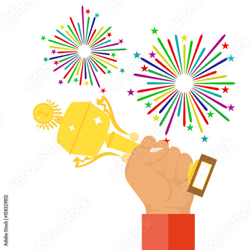 The hand holds a sports trophy