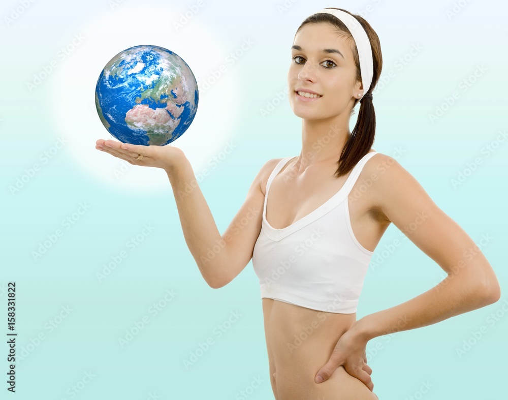 Beautiful young woman with the earth in hand Beautiful young woman with the earth in hand
