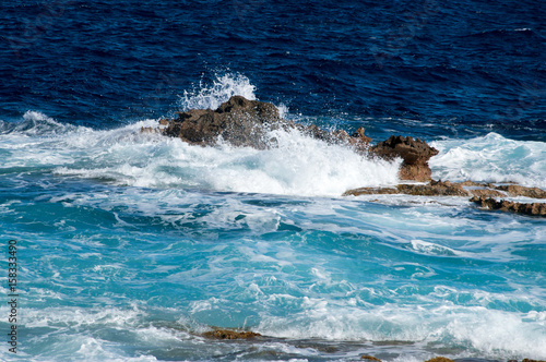 A wave and rocks at Malta near Cirkewwa Ferry Terminal.