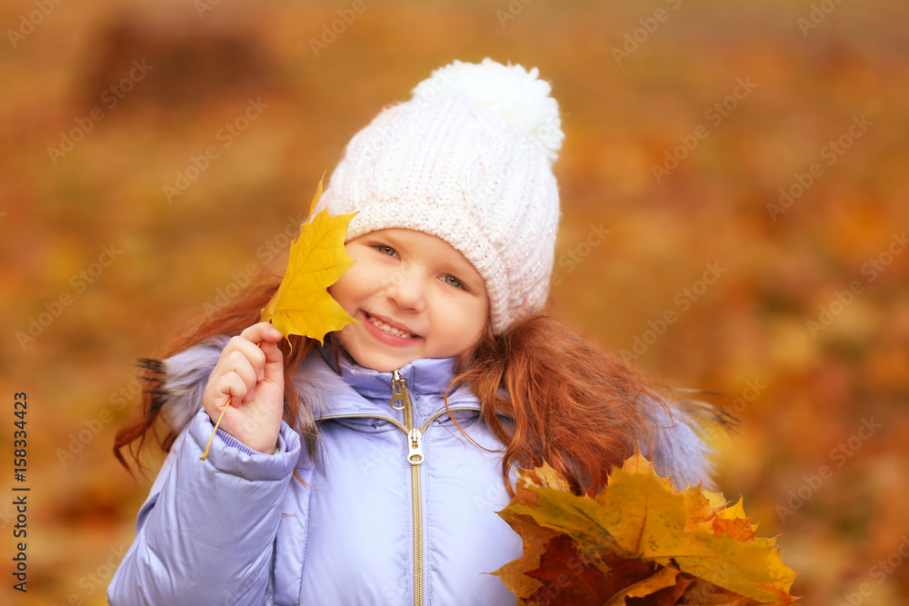 Cute little girl with bouquet of yellow leaves outdoors Cute little girl with bouquet of yellow leaves outdoors