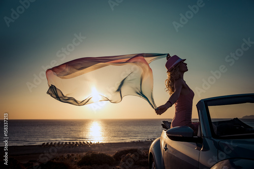 Silhouette of young woman at the beach