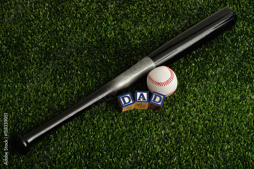 Canvas Print Dad spelled with colorful blocks with a baseball and a bat