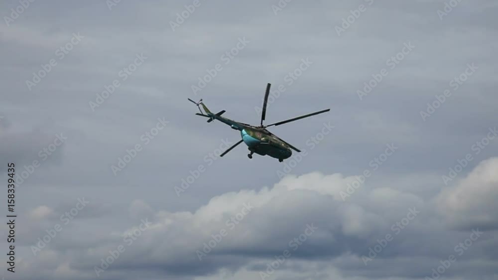 Russian army Mi-8 helicopter in action against cloudy sky Russian army Mi-8 helicopter in action against cloudy sky