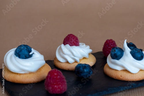 Waffle cookies with meringue and berries photo