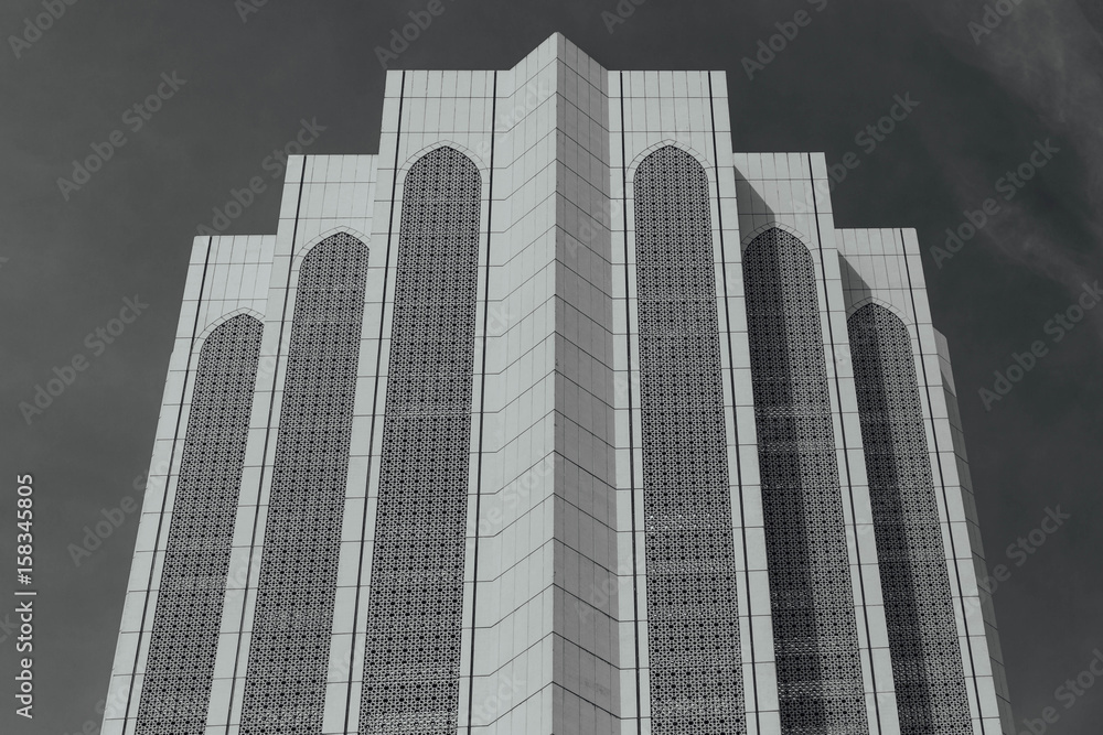 Black and white Dayabumi Complex building in the morning in Kuala Lumpur, Malaysia.