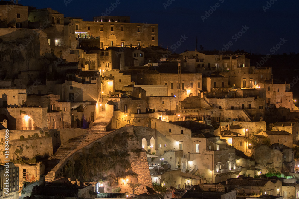 Matera, Italy - May 20, 2017: Night panoramic view of the city illuminated by the streetlights