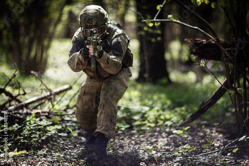 Military man in helmet ,camouflage