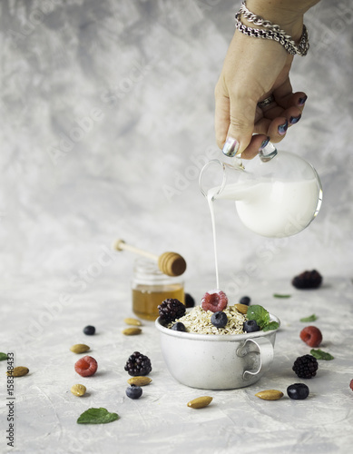 Healthy breakfast with oat flakes  raspberry berries  blueberries  selective focus