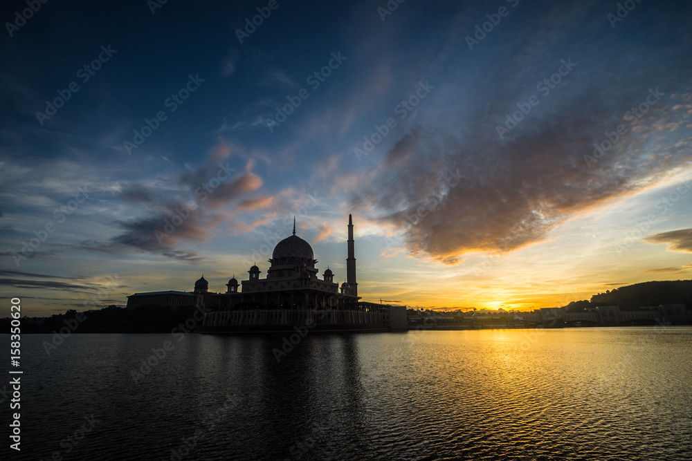 Sunrise moment at Putra Mosque, a principal mosque of Putrajaya, Malaysia. Construction of the mosque began in 1997 and was completed two years later.
