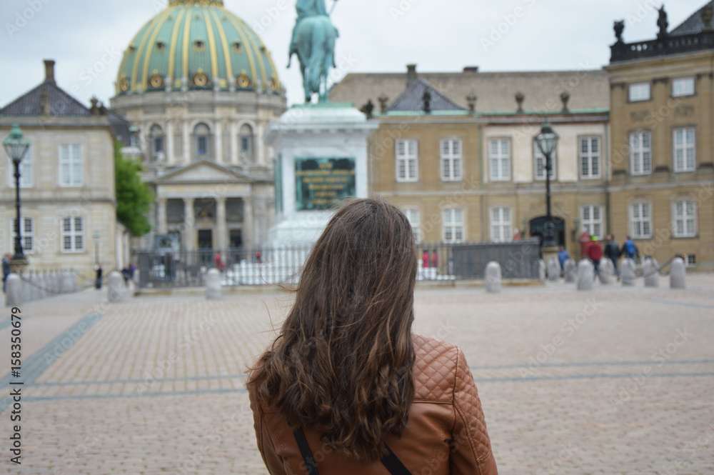 Back view of girl in Amalienborg square Copenhagen, Denmark