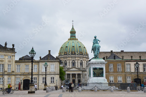 COPENHAGEN, DENMARK - MAY 31, 2017: Amalienborg Slotsplads square with a monumental equestrian statue of Amalienborg's founder, King Frederick V and Frederik's Church on the background, Copenhagen 
