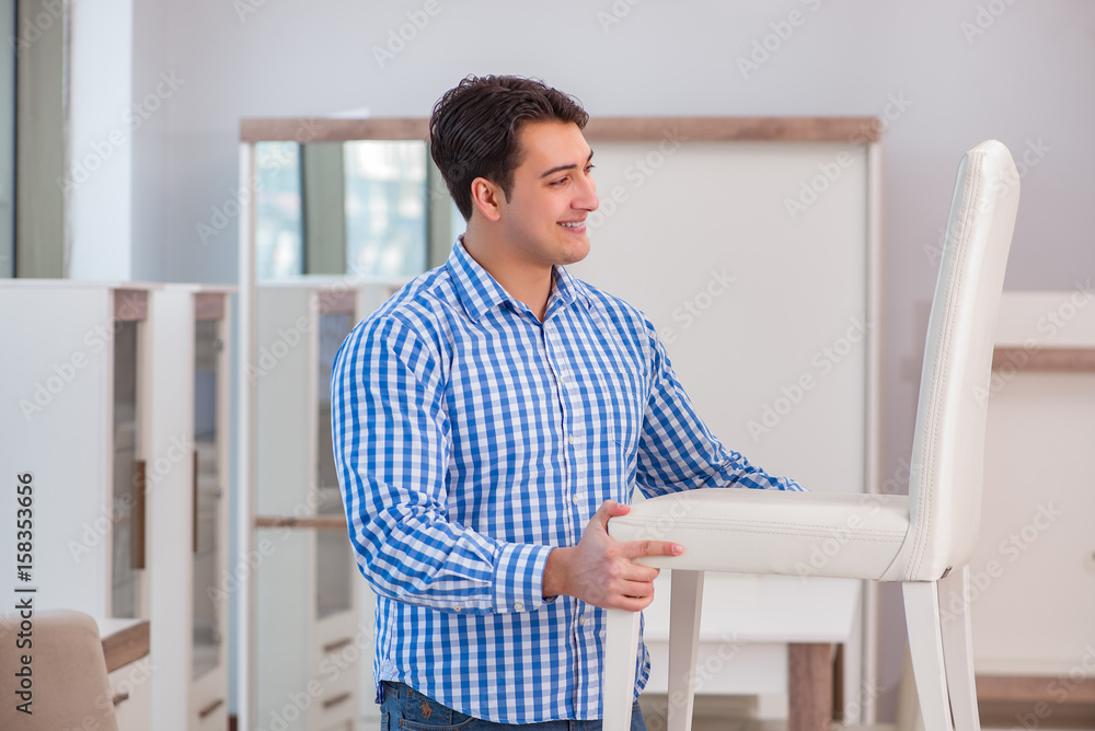 Fototapeta premium Young man shopping in furniture store