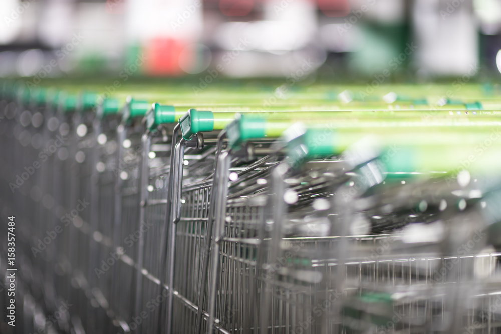 Shopping carts in a supermarket, detail of metal carts in a supermarket, order to make the purchase