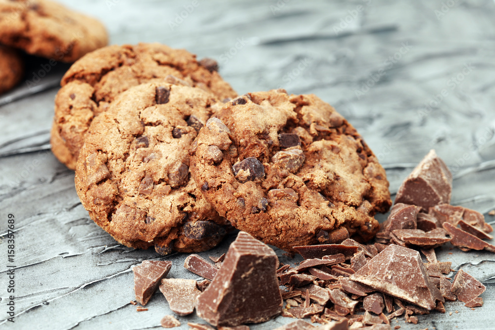 Fototapeta premium Chocolate cookies on wooden table. Chocolate chip cookies shot