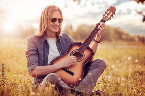 Young man playing a guitar